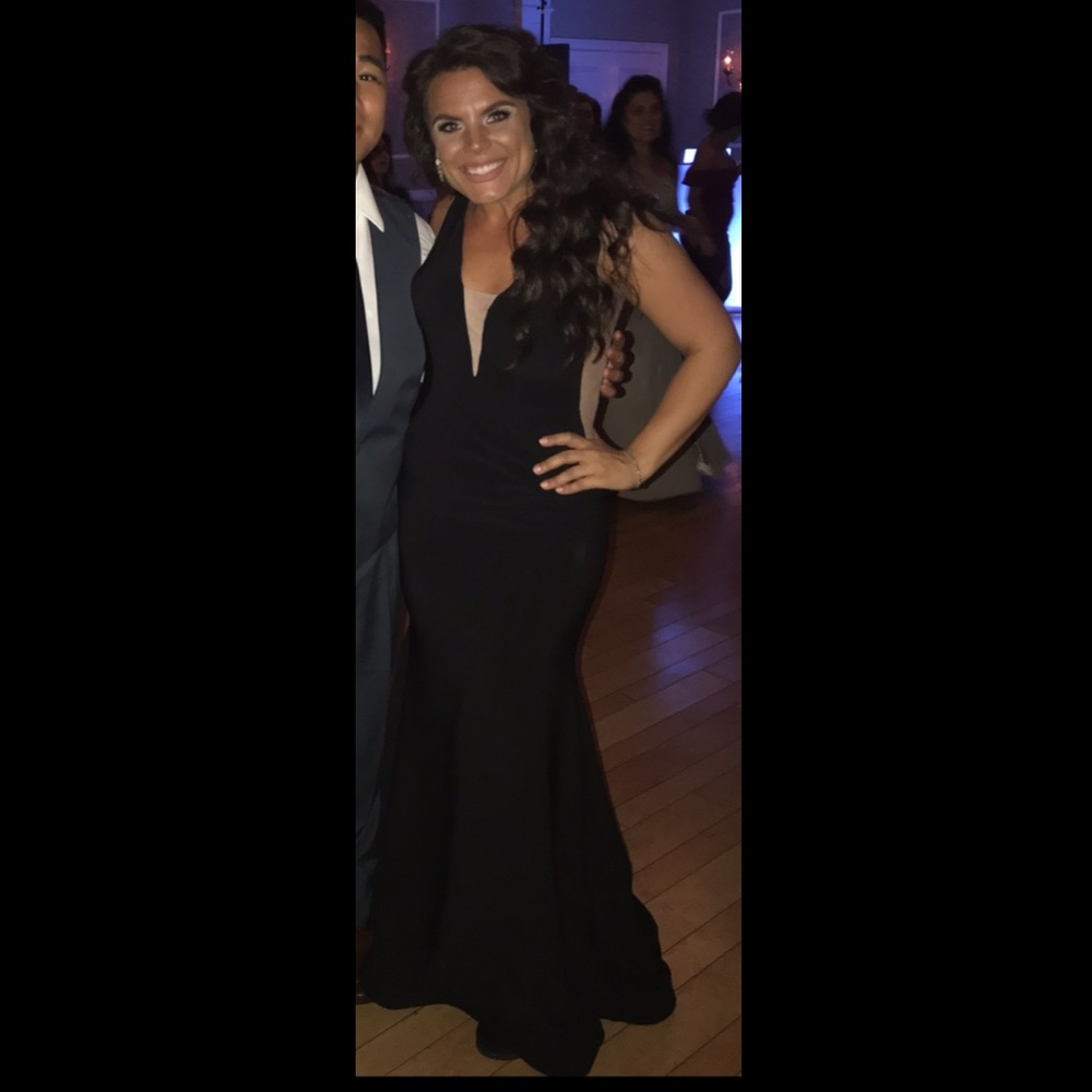 Beautiful black gown, nude mesh on sides. Low back. Size 4 worn once